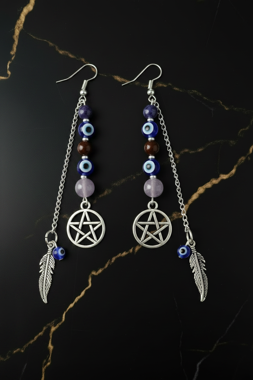 Two Identical Earrings on Black Gold Marble